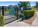 Gated community dog park with secure fencing and well-maintained landscaping at 3644 Pitch Ln, Sarasota, FL 34232