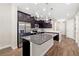 Bright, modern kitchen with stainless steel appliances, a spacious island, and plenty of cabinet storage at 3644 Pitch Ln, Sarasota, FL 34232