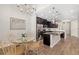 Bright kitchen and dining area with stainless steel appliances and modern lighting fixtures at 3644 Pitch Ln, Sarasota, FL 34232