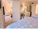 Cozy bedroom featuring two beds with star-patterned comforters, a dresser, and a doorway leading to a sitting area at 3660 Lake Bayshore Dr # K-321, Bradenton, FL 34205