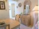 Inviting dining area showcases a neutral palette with a wall mirror at 3660 Lake Bayshore Dr # K-321, Bradenton, FL 34205