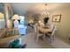Bright dining area with view of living space and sliding door to patio at 3660 Lake Bayshore Dr # K-321, Bradenton, FL 34205