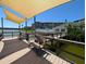 Scenic waterfront view from the community dock with benches and shaded seating, perfect for relaxation and enjoying the lake at 3660 Lake Bayshore Dr # K-321, Bradenton, FL 34205