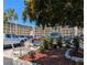 Well-maintained parking area near the condos with landscaping and trees for shade at 3660 Lake Bayshore Dr # K-321, Bradenton, FL 34205