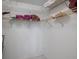 Spacious walk-in closet with wire shelving and ample storage space at 3673 Longmeadow # 18, Sarasota, FL 34235