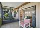 Relaxing screened-in patio featuring comfortable seating, access to an outdoor area and views of interior at 3673 Longmeadow # 18, Sarasota, FL 34235
