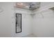 Walk-in closet with wire shelving providing ample storage space, and well lit at 3673 Longmeadow # 18, Sarasota, FL 34235