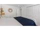 This bedroom boasts ample closet space and serene white walls, creating a calming retreat at 4390 Exeter Dr # 206, Longboat Key, FL 34228