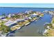 Aerial view of waterfront community with canal access, lush landscaping and stunning Gulf views at 4908 Arlington Rd, Palmetto, FL 34221