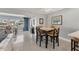 Open-concept dining space showcasing modern furnishings and a bright, airy atmosphere at 4908 Arlington Rd, Palmetto, FL 34221