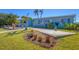 Charming home exterior featuring lush landscaping, a well-manicured lawn, and a welcoming facade at 4908 Arlington Rd, Palmetto, FL 34221