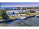 Charming waterfront home with private boat lift and dock provides Gulf access and stunning water views at 4908 Arlington Rd, Palmetto, FL 34221