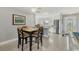 Cozy dining area leading to a bright kitchen with stainless steel appliances and ample natural light at 4908 Arlington Rd, Palmetto, FL 34221