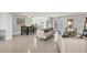 Inviting living area connects to a bright, modern kitchen, and dining area with terrazzo floors at 4908 Arlington Rd, Palmetto, FL 34221