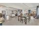 Bright and airy open-concept living and dining area with modern furnishings and plenty of natural light at 4908 Arlington Rd, Palmetto, FL 34221