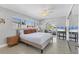 Serene Primary bedroom with large windows, a ceiling fan, and access to the living room at 4908 Arlington Rd, Palmetto, FL 34221