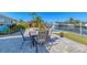 Outdoor patio with canal view, with a paver patio area and seating at 4908 Arlington Rd, Palmetto, FL 34221