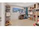 Well-organized storage room with shelving units, boxes, and a view of the outdoors from the window at 4908 Arlington Rd, Palmetto, FL 34221
