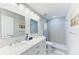 Modern bathroom with double sinks, decorative tile shower, and elegant fixtures create a spa-like experience at 507 Shore Dr, Largo, FL 33771