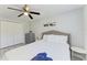 This bedroom features a single bed, closet and a ceiling fan at 507 Shore Dr, Largo, FL 33771