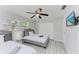 This bedroom features two twin beds, closet and mounted television at 507 Shore Dr, Largo, FL 33771