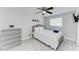 Bright bedroom features a single bed, neutral tones, and a ceiling fan for added comfort at 507 Shore Dr, Largo, FL 33771