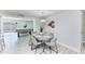 Light-filled dining area with views to the pool table and outdoor pool at 507 Shore Dr, Largo, FL 33771