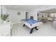 Spacious game room features a pool table, nautical decor, and light wood floors at 507 Shore Dr, Largo, FL 33771