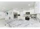 Spacious kitchen with granite countertops, stainless steel appliances, and ample cabinetry at 507 Shore Dr, Largo, FL 33771