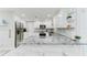 Well-equipped kitchen with granite countertops, stainless steel appliances, and island at 507 Shore Dr, Largo, FL 33771