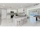 Modern kitchen featuring granite counters, stainless steel appliances, and breakfast bar at 507 Shore Dr, Largo, FL 33771