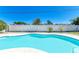 Enjoy the pool surrounded by lush landscaping and a privacy fence at 507 Shore Dr, Largo, FL 33771