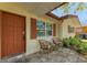 Welcoming porch area with comfortable seating, perfect for enjoying peaceful outdoor moments at 507 Shore Dr, Largo, FL 33771