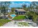 Spectacular aerial view of a pool, landscaped yard, with Gulf views at 5125 Gulf Of Mexico Dr # 4, Longboat Key, FL 34228