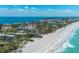 Scenic aerial view highlights luxury beachfront condos and turquoise Gulf waters at 5125 Gulf Of Mexico Dr # 4, Longboat Key, FL 34228