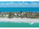 Breathtaking coastal aerial view with beachfront property and Gulf of Mexico at 5125 Gulf Of Mexico Dr # 4, Longboat Key, FL 34228