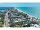 Picturesque aerial view features luxurious beachfront condos and the turquoise Gulf of Mexico at 5125 Gulf Of Mexico Dr # 4, Longboat Key, FL 34228