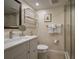 Clean bathroom features a sink with a large mirror, a toilet and glass door walk-in shower at 5125 Gulf Of Mexico Dr # 4, Longboat Key, FL 34228