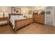 Comfortable bedroom featuring wicker furniture, tiled floors, and warm lighting at 5125 Gulf Of Mexico Dr # 4, Longboat Key, FL 34228