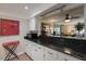 Kitchen counter pass-through to the living room offers an open concept living space at 5125 Gulf Of Mexico Dr # 4, Longboat Key, FL 34228
