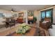 Bright living room with dining area and patio access at 5125 Gulf Of Mexico Dr # 4, Longboat Key, FL 34228