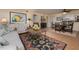 Open-concept living room with dining area and view into the kitchen at 5125 Gulf Of Mexico Dr # 4, Longboat Key, FL 34228