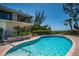 Sparkling pool with views of the ocean and a large patio at 5125 Gulf Of Mexico Dr # 4, Longboat Key, FL 34228