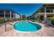Inviting community pool surrounded by lounge chairs for relaxing at 5125 Gulf Of Mexico Dr # 4, Longboat Key, FL 34228