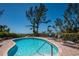 Inviting community pool with beach access and comfortable lounge seating at 5125 Gulf Of Mexico Dr # 4, Longboat Key, FL 34228