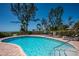 Community pool with lounge chairs and beach access at 5125 Gulf Of Mexico Dr # 4, Longboat Key, FL 34228
