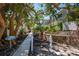 Charming walkway through tropical landscaping to the Seagrape office at 5125 Gulf Of Mexico Dr # 4, Longboat Key, FL 34228