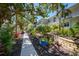 Inviting walkway leading to condos surrounded by beautiful landscaping at 5125 Gulf Of Mexico Dr # 4, Longboat Key, FL 34228