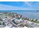 This aerial view shows the resort-style condo complex's proximity to the beach, water, and boating at 5325 Marina Drive # 423, Holmes Beach, FL 34217