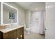 Bathroom showcasing a vanity with mirror, toilet and shower/tub with white tiling at 5325 Marina Drive # 423, Holmes Beach, FL 34217